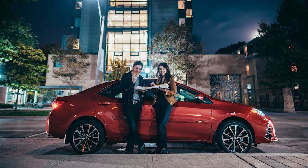 Couple-Beside-2017-Corolla-in-Red.jpg