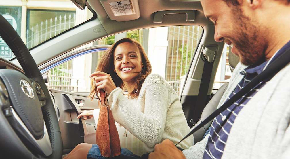 Couple-Seated-in-Front-Seats-of-Toyota.jpg