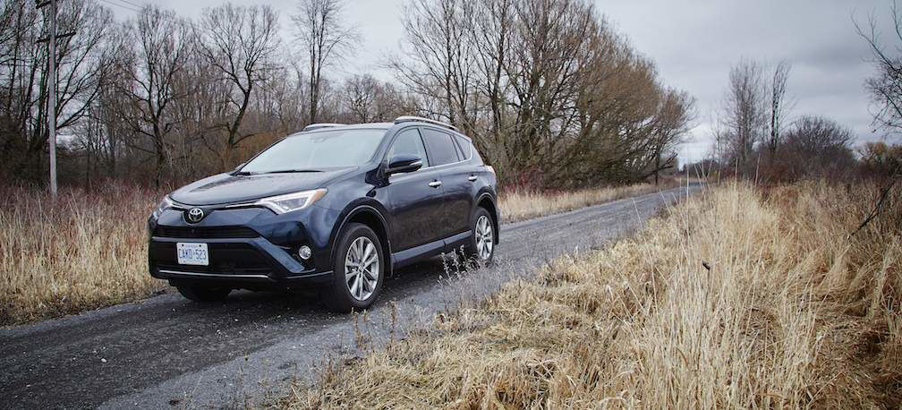 RAV4-World-of-Weekends-Black-RAV4-Driving-Through-Field.jpg
