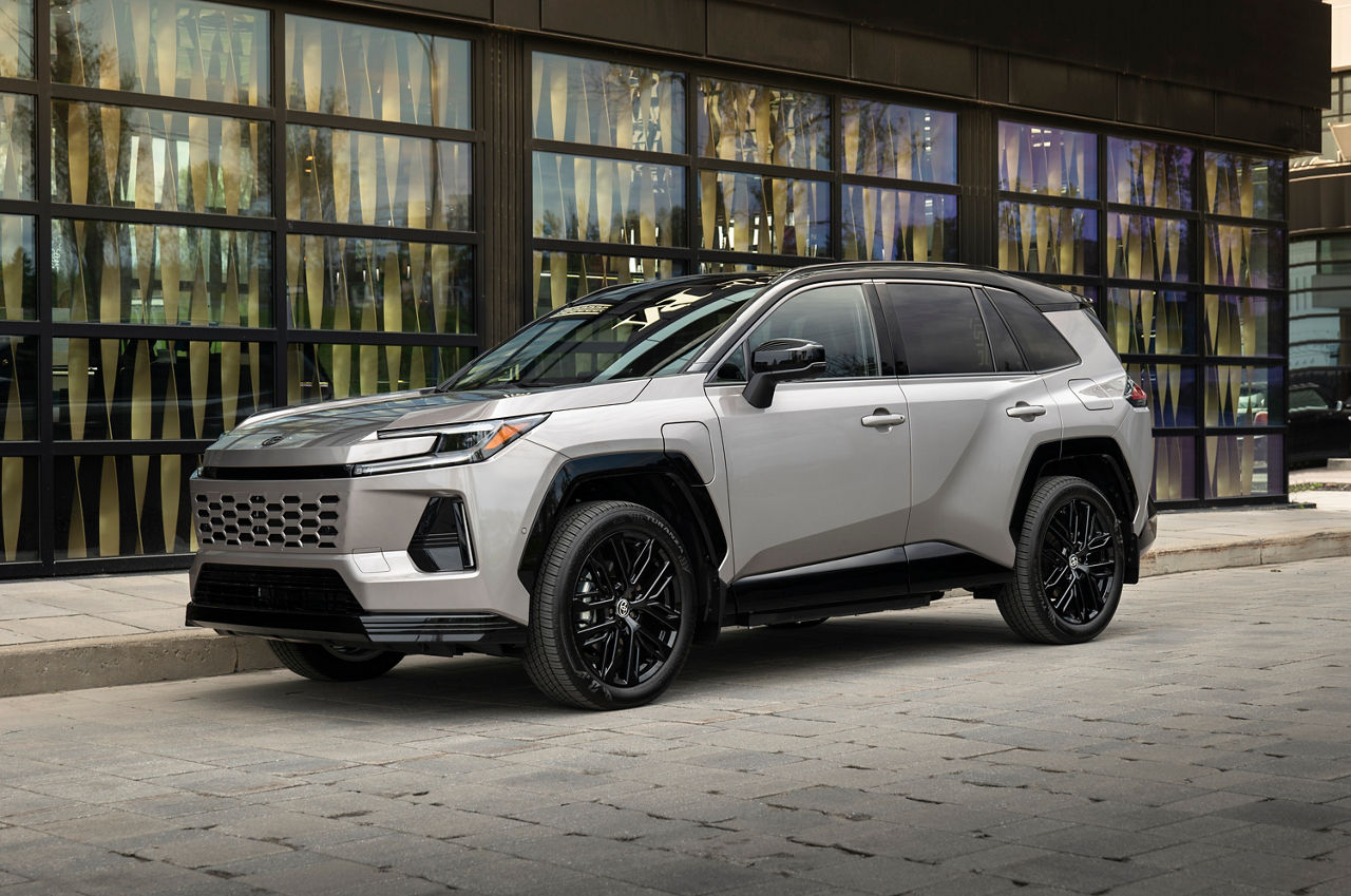 Official Toyota Canada image of a silver 2026 RAV4 Plug-in Hybrid XSE Technology parked outside a building