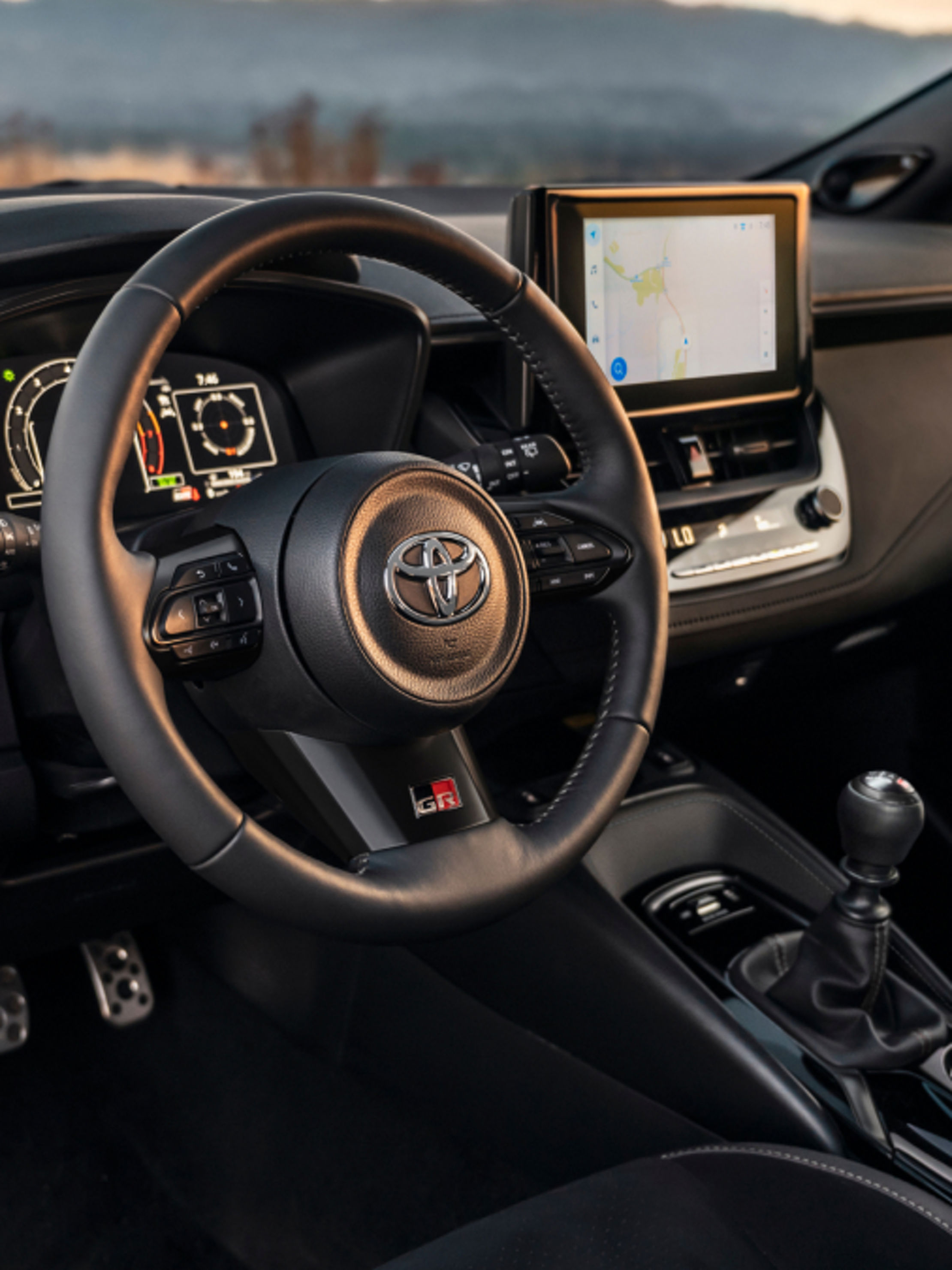 styleguide_toyota-2025-gr-corolla-core-interior-black-steering-wheel-dashboard-tile-l