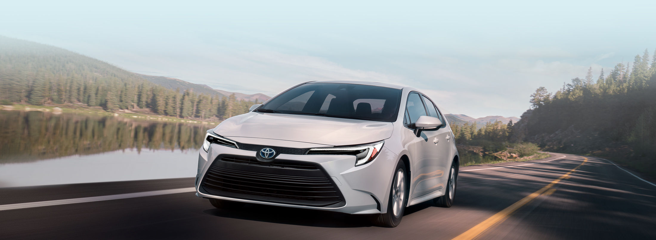 toyota-warranty-coverage-new-vehicle-2023-corolla-hybrid-le-white-lineup-l-1