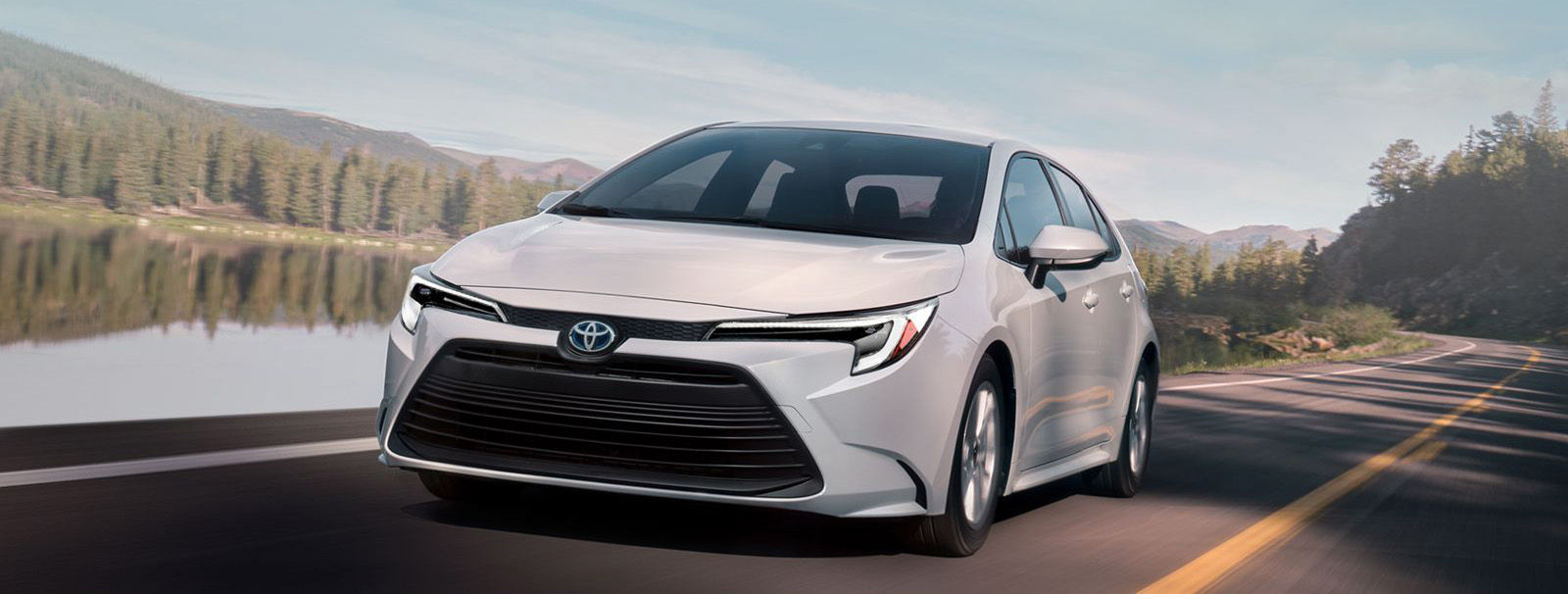 toyota-warranty-coverage-new-vehicle-2023-corolla-hybrid-le-white-lineup-m-cropped