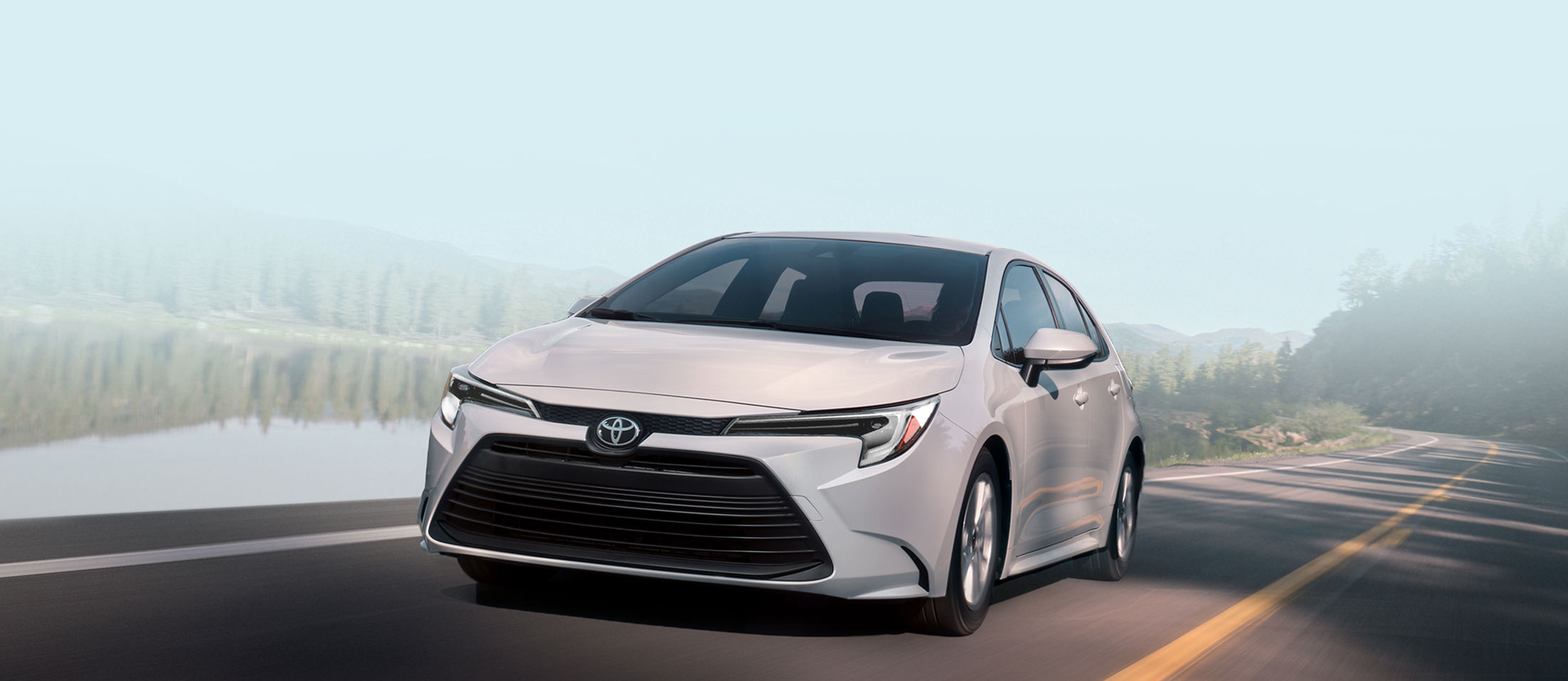 toyota-warranty-coverage-new-vehicle-2026-corolla-hybrid-le-white-lineup-l-1